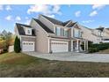 Two-story home boasts a spacious two-car garage and inviting front porch, complemented by manicured landscaping at 278 Bandana Way, Cameron, NC 28326