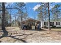 Home's exterior featuring a large utility shed or carport, perfect for storage or covered parking at 121 H B Dr, Spring Lake, NC 28390