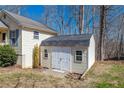 Durable storage shed in the backyard for tools and equipment with a gable roof at 4901 North Pointe, Sanford, NC 27332