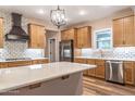Kitchen with stainless appliances, white subway tile backsplash, and an island at 525 Sanctuary Trl, Cameron, NC 28326