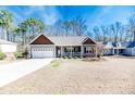 Attractive single-Gathering home featuring a covered porch and a well-maintained front lawn at 8016 Royal Dr, Sanford, NC 27332