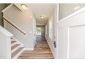 Inviting entryway with wood-look flooring and a staircase at 932 Allstar Ave, Cameron, NC 28326