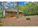 Charming home with a welcoming front porch, steps, wood accents and professionally landscaped yard at 1393 Pennsylvania Ave, Sanford, NC 27332