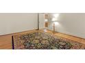 Bedroom featuring wood floors, large decorative area rug and classic decor at 2613 Watson Ave, Sanford, NC 27332