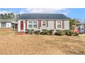 Quaint single-story house featuring a tidy front yard and classic design at 2613 Watson Ave, Sanford, NC 27332