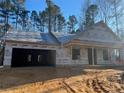 New home under construction showcases framing, sheathing, and covered porch at 84 Peach Orchard (Lot 4) Ln, Lillington, NC 27546