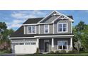 Gray two-story home with white trim, a well-manicured lawn, and inviting front porch showcasing suburban charm at 96 Peach Orchard (Lot 5) Ln, Lillington, NC 27546