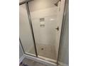 Modern glass enclosed shower featuring white subway tile, and mosaic tiled floor at 96 Peach Orchard (Lot 5) Ln, Lillington, NC 27546