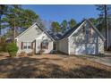 Charming single-Gathering home with a two-car garage and lush landscaping, nestled in a quiet neighborhood at 48 Cedar Ln, Sanford, NC 27332