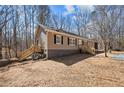 Side view of a ranch home showing the yard and foundation at 9349 Perry Rd, Graham, NC 27253