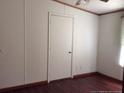 Simple bedroom with hardwood floors and a window bringing in natural light, cozy and comfortable at 165 Brent Wood, Sanford, NC 27332