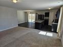 Bright living room flows into a modern kitchen, perfect for entertaining and Gathering gatherings at 280 Hallow Oak Dr, Spring Lake, NC 28390