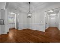 Elegant dining room showcasing hardwood floors, decorative molding, and stylish pendant lighting at 45 Glen Bend Ct, Spring Lake, NC 28390