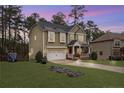 Beautiful two-story home featuring a spacious yard and inviting curb appeal at 63 Slate Dr, Spring Lake, NC 28390