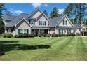 Beautiful home with a large front yard and well-maintained landscaping at 105 Lakewood Vw, Sanford, NC 27332