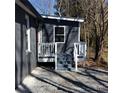 Back porch of the home with railings at 311 Saunders St, Sanford, NC 27330