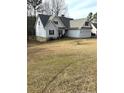 Well-maintained single-Gathering home featuring an attached two-car garage and manicured lawn at 124 Brookfield Cir, Sanford, NC 27330