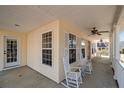 Inviting front porch with rocking chairs, ceiling fan and classic design elements perfect for relaxation at 281 Pineridge Cv, Sanford, NC 27332