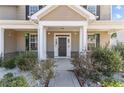 Inviting front porch with decorative columns and landscaping at 30 Yaupon Cir, Spring Lake, NC 28390