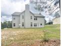 Two-story home exterior showing spacious backyard, and patio area great for entertaining guests at 85 Clearview Ct, Sanford, NC 27332