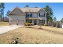 Two-story home with a two car garage and a spacious front yard at 85 Clearview Ct, Sanford, NC 27332
