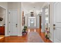Lovely foyer with hardwood floors, decorative columns, and a view of the front door at 85 Clearview Ct, Sanford, NC 27332
