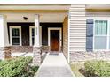 Inviting front porch with stone accents and craftsman details at 202 Captain Hbr, Sanford, NC 27332