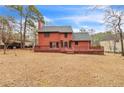 Expansive backyard features a large wooden deck perfect for outdoor entertaining and relaxation at 28 Ravens Wood Cir, Sanford, NC 27332