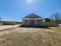 Inviting single-story home featuring a classic design and a tidy front yard at 301 W Duke St, Dunn, NC 28334