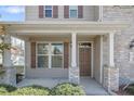 Inviting front porch with stone pillars, offering a welcoming entrance to the home at 451 Colonist Pl, Cameron, NC 28326