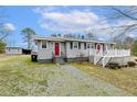 Well-maintained home featuring an expansive front yard, two front doors, and space for outdoor enjoyment at 148 Manchester Dr, Goldston, NC 27252