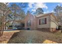 Attractive home with a two-car garage, brick accents, and well-maintained landscaping at 51 Cedar Ln, Sanford, NC 27332