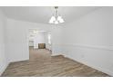 Bright dining room featuring wood floors and a modern chandelier at 321 Coleman Ave, Rocky Mount, NC 27801