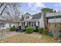 Charming home featuring a cozy covered porch and well-maintained landscaping at 321 Coleman Ave, Rocky Mount, NC 27801