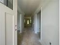 Bright hallway with white trim and open doorways offers a glimpse of the home's layout at 45 Pine Hill Ct, Spring Lake, NC 28390