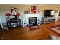 Cozy living room featuring a fireplace, hardwood floors, and ample seating at 1002 Godwin Ln, Dunn, NC 28334