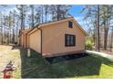 Nice grass surrounds the property with a partial view of the red fire hydrant at 306 Harbor Trace, Sanford, NC 27332