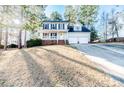 Charming two-story home with a well-manicured lawn and inviting front porch at 336 Richmond Park Dr Dr, Cameron, NC 28326