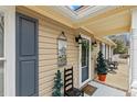 A welcoming front porch adorned with charming decorations and comfortable seating, creating a cozy and inviting entrance at 2123 Detroit Blvd, Sanford, NC 27332