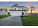 Inviting two-story home with a two-car garage and meticulously kept front yard at 30 Blackgum Ct, Spring Lake, NC 28390