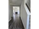 Home foyer featuring hardwood floors with a staircase to the right and view into the living room at 30 Blackgum Ct, Spring Lake, NC 28390