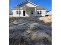 New construction home with white siding, covered back porch, and trimmed windows at 52 Blackgum Ct, Spring Lake, NC 28390