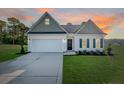 Charming single-story home with a two-car garage and well-maintained landscaping at 52 Blackgum Ct, Spring Lake, NC 28390