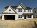 Exterior elevation of home under construction, highlighting framing, window placements, and the garage at 120 Steeple Rdg, Cameron, NC 28326