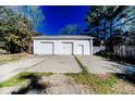 Spacious detached garage with multiple bays and a wide concrete driveway provides ample parking at 488 Hall Rd, Erwin, NC 28339