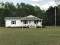 Charming single-story home with a well-maintained front yard and welcoming front porch at 146 E Cool Springs E Rd, Lillington, NC 27546