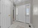 Inviting foyer features tiled floor, transom windows, and neutral paint at 346 Northview Dr, Sanford, NC 27332