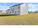 Spacious backyard with ample green space, perfect for outdoor activities and relaxation at 41 Aldermann (Lot 2) Ct, Dunn, NC 28334