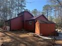 Rear view of the home featuring a storage shed in a spacious backyard at 972 High Harbor Rd, Sanford, NC 27332