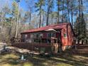 Exterior of home with a large wooden deck perfect for outdoor entertaining at 972 High Harbor Rd, Sanford, NC 27332